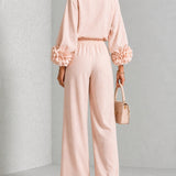 Liva | Rosa Set mit Blumenmanschetten und weiten Hosen